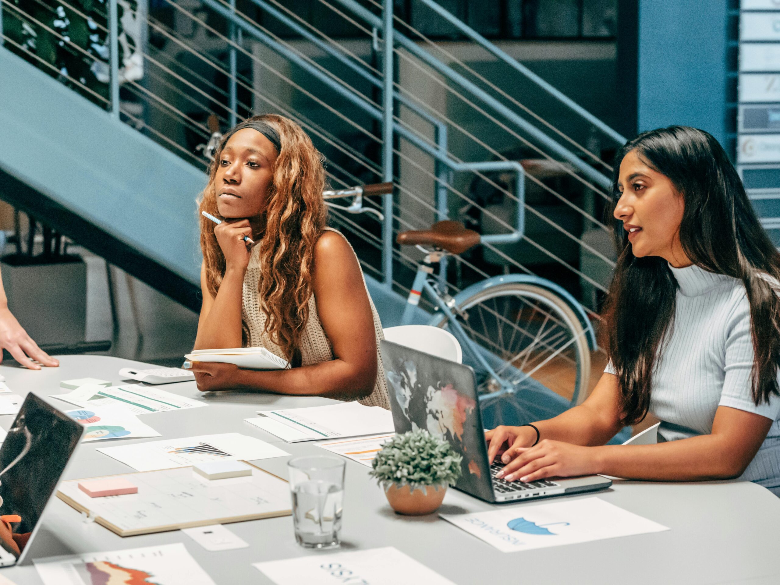 Is affiliate marketing legit? Two women sitting in a conference room.